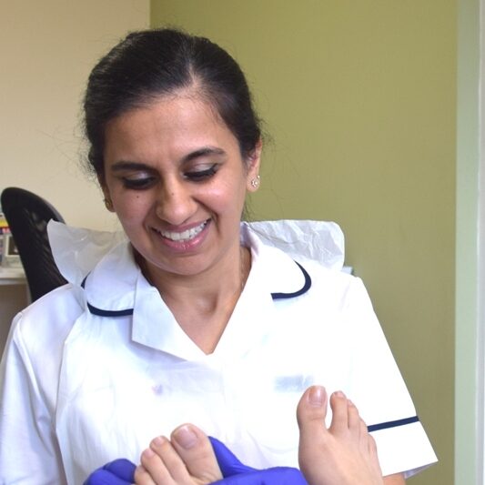 Ruby Kallah, podiatrist treating a patient at Ruby Kallah Foot Clinic, Huntingdon